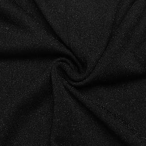 Close-up of black fabric texture with subtle shimmering particles and fine material details
