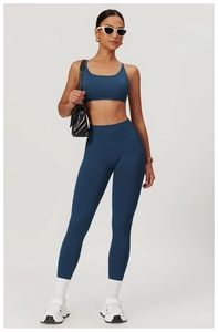 Detail of high-waist seamless scrunch butt yoga pants and sports bra set in lake blue