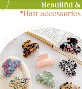 Selection of tortoiseshell acetate hair claw clips displayed on a decorative tray