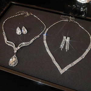 Luxurious silver diamond-encrusted geometric teardrop necklace and earrings jewelry set