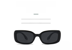 Detail view of rectangular polarized kids sunglasses with black silicone frames and dark lenses