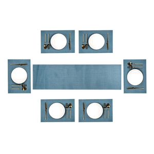Blue woven placemat set and table runner arrangement shown from an overhead perspective