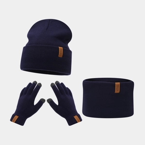 Detail of 3-in-1 navy knit set with beanie, scarf, touchscreen gloves and leather labels