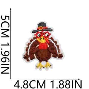 Detail view of cartoon turkey embroidery patch showing 5cm x 4.8cm size measurements