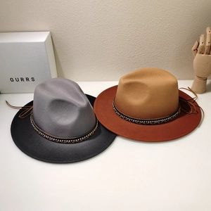 Detail of wool fedora hats featuring two-tone color blocks and exquisite ethnic hatbands