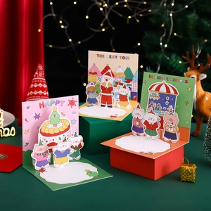 3D pop-up Christmas cards with gold foil stamping and envelopes in holiday scenery