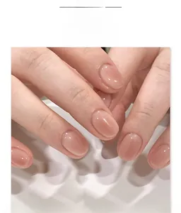 Close-up of JP4137 short oval press-on nails with natural blush pink gradient finish