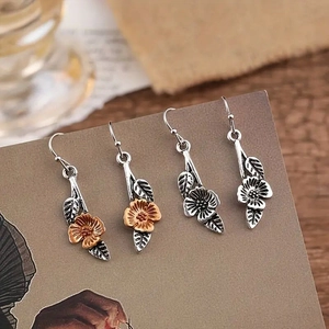 Vintage floral and leaf dangle earrings in antique silver and two-tone gold finishes