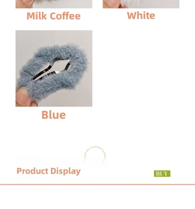 Detail view of plush cloud hair clips in coffee, white, and blue fuzzy faux fur material
