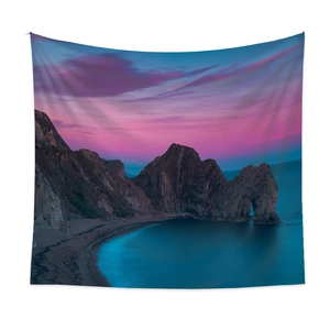 Bohemian coastal landscape tapestry featuring a seaside stone arch at sunset on a white wall