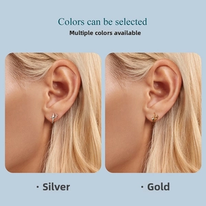 Detail showing minimalist S925 sterling silver star-shaped stud earrings in gold and silver