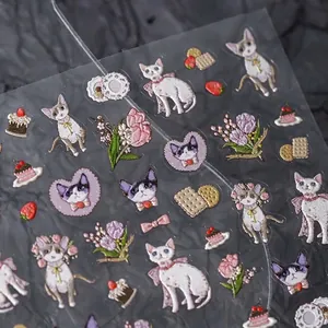 Cartoon cat theme PET nail stickers with floral patterns and matte textured finish