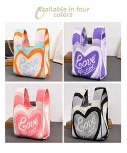 Detail view of four knit tote bags featuring vibrant love patterns in various colors