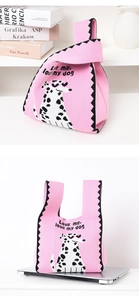 Detail of pink knitted tote bag with dalmatian pattern and Love me, love my dog text
