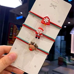 Three-piece Christmas hair tie set with Santa, reindeer and bell charms for women