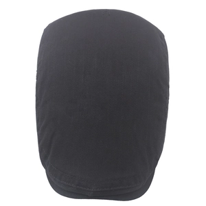 Top-down view of a classic black cotton twill beret hat with a short brim for men