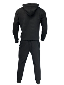 Rear view of black hooded tracksuit featuring detailed diamond geometric textured fabric