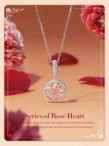 Close-up of rose gold Tree of Life charm with zircons and decorative rose petals