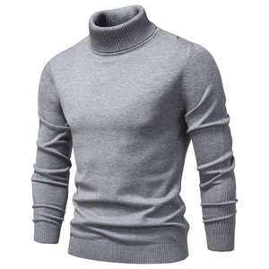 Detail of grey men's turtleneck sweater showing fine knit texture and slim fit design