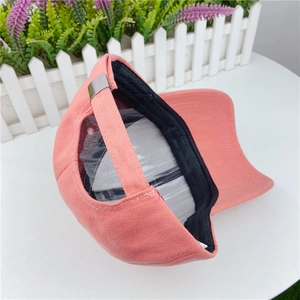 Pink cotton baseball cap featuring a metal adjustable strap buckle and neat stitching