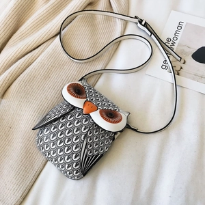 Cartoon owl crossbody bag with black feather print and cute 3D orange beak details