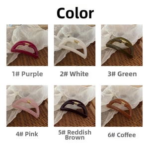 Close-up of hollow geometric claw clips in six colors including purple and dark green
