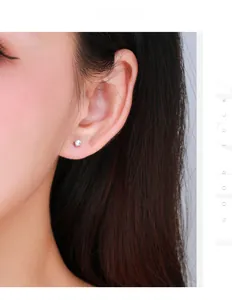 Close-up of sparkling moissanite stud earring in S925 sterling silver on woman's ear