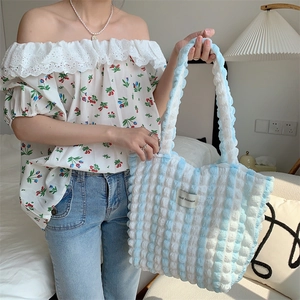 Detail of blue striped bubble textured tote bag with LOVE SOZAKKA woven label