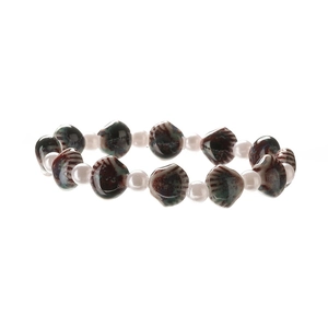Close-up of vintage beaded bracelet with striped ceramic shells and pink pearls