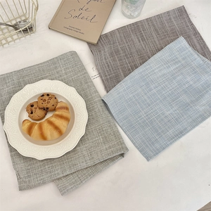 Linen plaid placemats in green, brown, and blue colors for modern home dining table