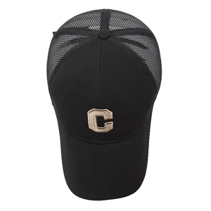 Breathable black mesh trucker hat with beige embroidered C letter on a curved brim cap