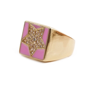 Detail of gold-plated square ring with pink enamel star and inlaid white cubic zirconia
