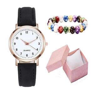 Set orologio al quarzo luminoso con cassa oro rosa, cinturino nero e bracciale di perle