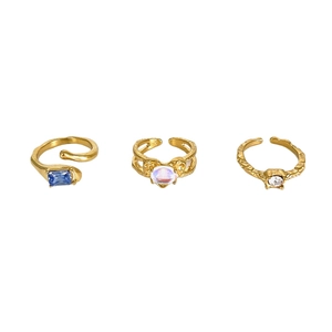 Three-piece gold adjustable ring set with blue, heart-shaped, and zircon stones