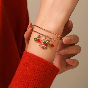 Close-up of adjustable Christmas bracelet with snowflake charms on a female wrist