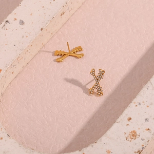 Gold-plated X-shape bone stud earrings with white rhinestones and polished finish