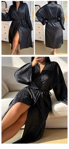 Detail of black satin leopard print robe showing silky texture and waist tie closure