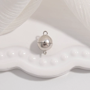 Macro view of a spherical S925 sterling silver magnetic clasp for jewelry DIY bracelets