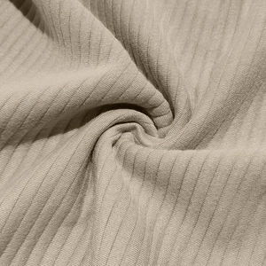 Macro detail of elastic ribbed knit fabric in beige for men's casual sweatshirts