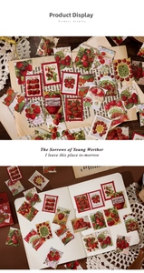 Detail of vintage strawberry stickers with stamp edges on a wooden desk background