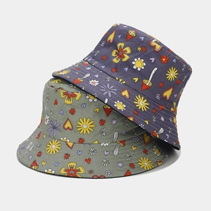 Women's reversible bucket hat featuring cute floral and mushroom prints in canvas material