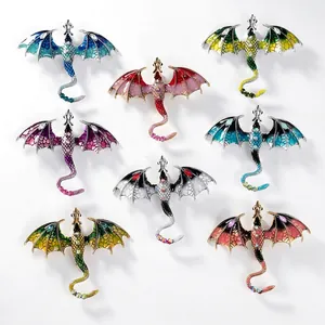 Collection of colorful vintage dragon brooches with enamel finish and crystal details