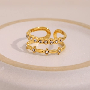 Macro detail of 18K gold-plated double-layer ring featuring sparkling white crystals
