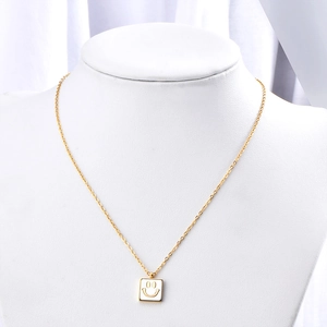 18K gold-plated titanium steel necklace with a square white enamel smiley face pendant