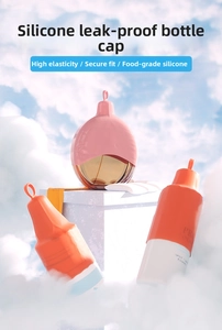 Leak-proof silicone travel bottle sleeves in pink and orange colors on an elegant stand