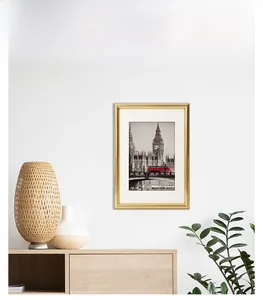 Golden picture frame with London Big Ben art in a modern interior setting