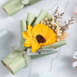 Detail of soap sunflower bouquet with baby's breath in light green gift wrap