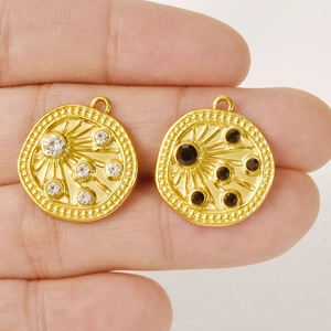 18k gold plated stainless steel sunburst pendants with black and white zircon crystals