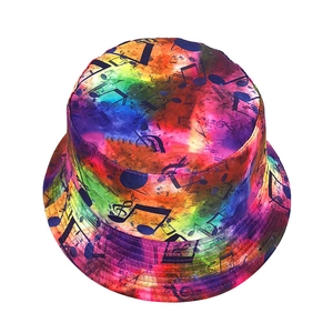 Detailed top view of tie-dye bucket hat featuring black musical notes and vibrant colors