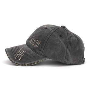 Detail of washed cotton baseball cap with leopard print underbrim and side embroidery